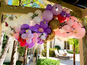 Beautiful deluxe balloon Arch detailed with butterfly flowers and greens